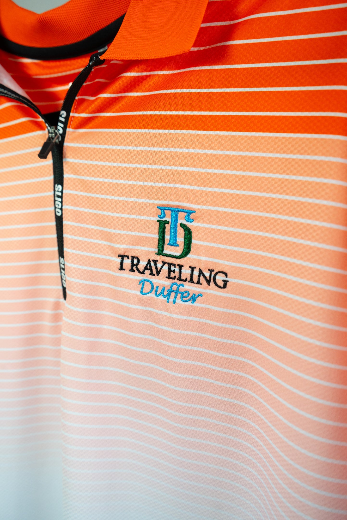 Sligo Performance Quarter-Zip Polo – Sunset Stripe